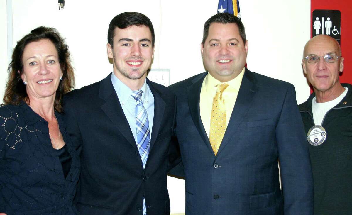 The New Milford Rotary Club recently presented its February 2017 Student of the Month award to Sam Maniscalco, a senior at New Milford High School. Tom is an honor student, winner of the Xerox Award for Innovation and Technology and a member of the SWC All-Academic Team. His is captain of the varsity football team and a HOBY Scholar. The senior plans to pursue a degree in international relations with a career goal of working in the U.S. State Department. He is shown above, second from left, with his mother, Keelin Maniscalco, NMHS teacher Kevin Best and Rotarian Tom McSherry.