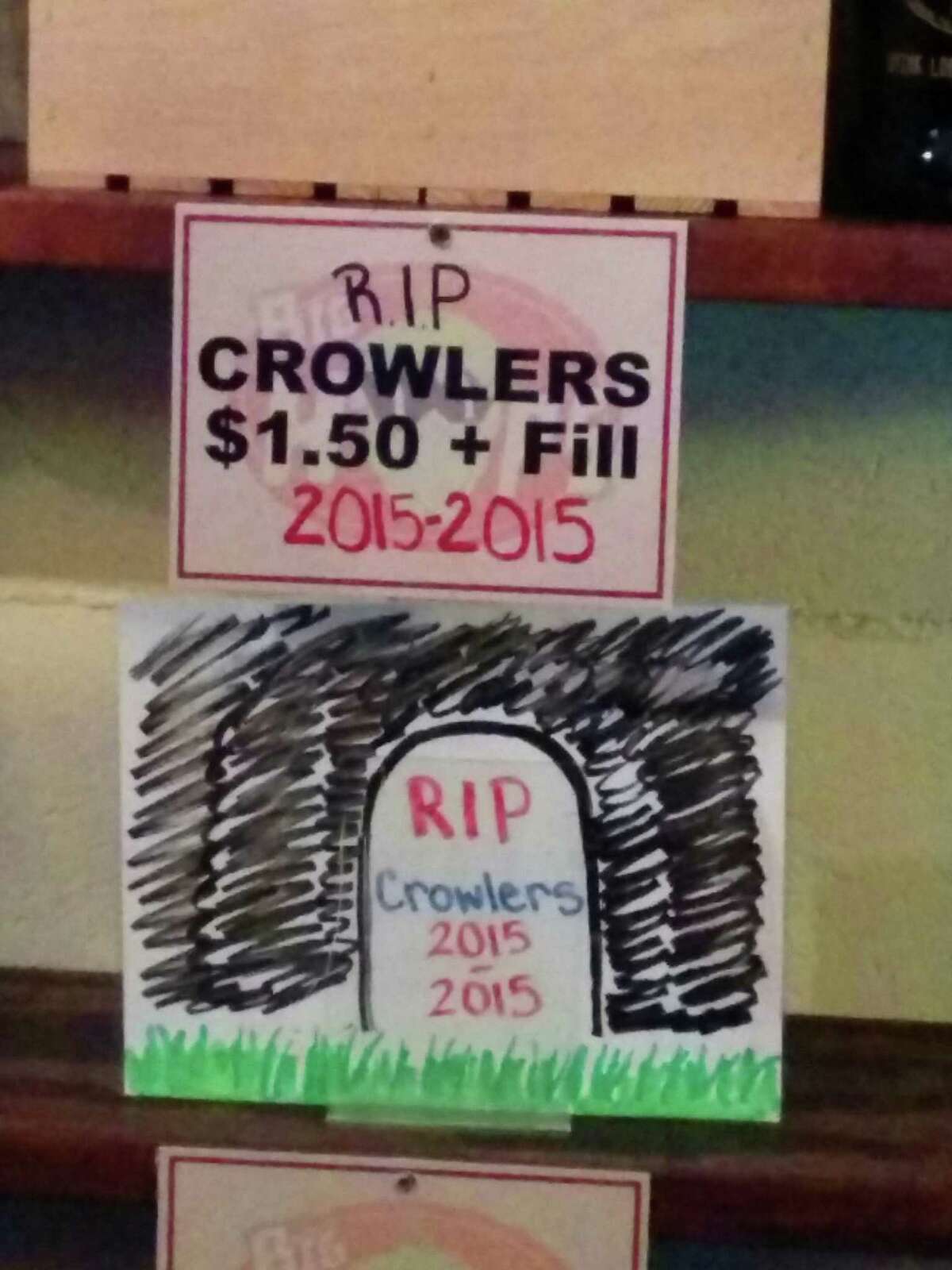 A sign at Big Hops Growler Station laments the 2015 decision by the Texas Alcoholic Beverage Commission that retailers cannot sell crowlers, or quart-size cans that are sealed with the customer's beer of choice at purchase time. A bill currently before the Texas House, HB 908, would explicitly legalize sales of crowlers.