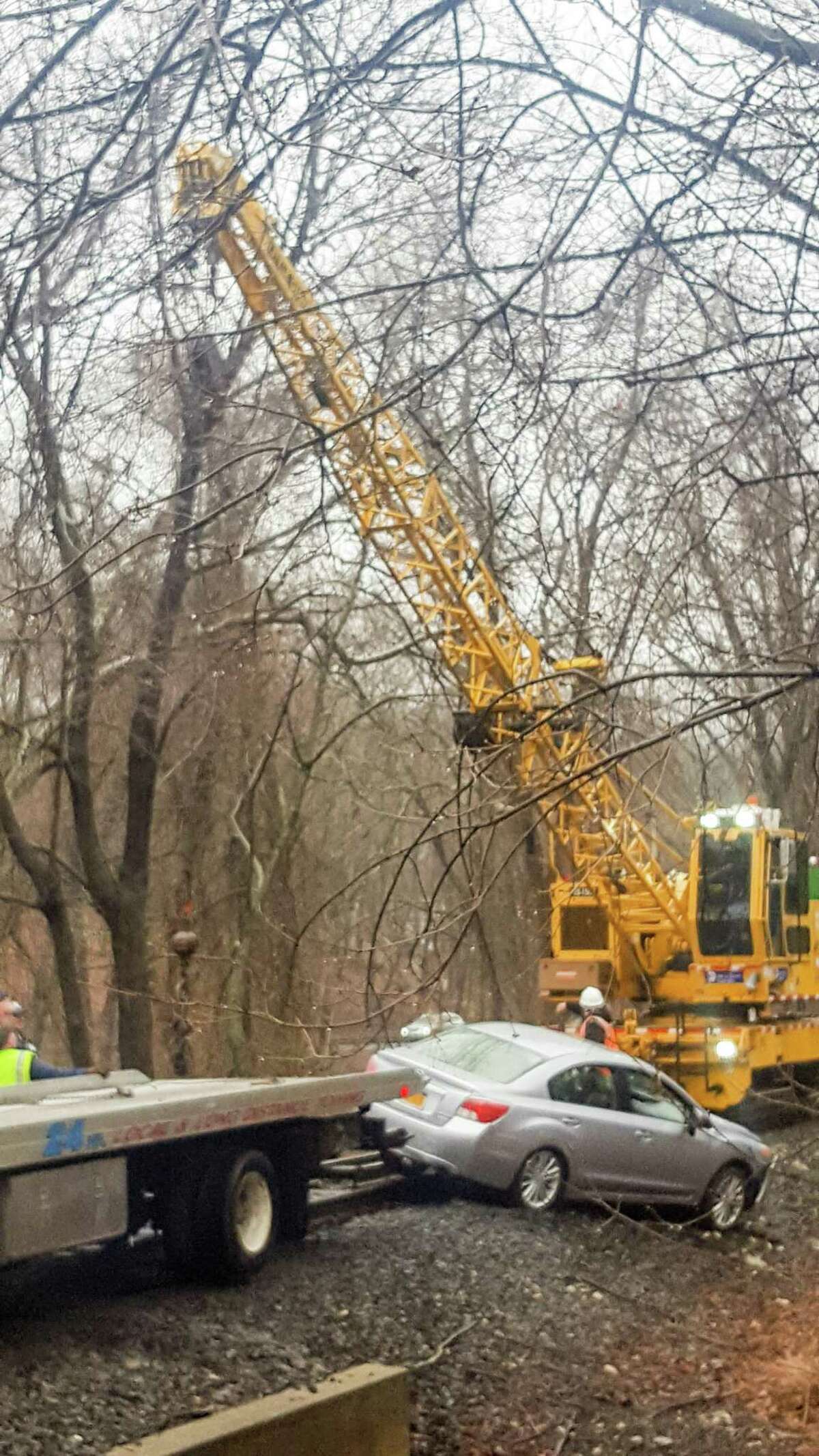 The Danbury Branch of the Metro-North Railroad is experiencing delays from Wilton to Branchville after a one-car crash led to a car getting stuck at the Mather Road grade crossing in Wilton, police said.