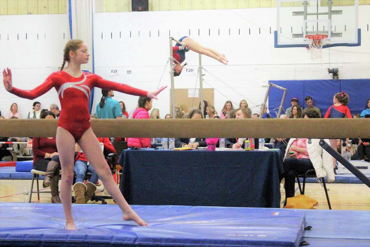 Alyson Scheurkogel of the Wilton Y Gymnastics team competes at Level 5, on beam during the recent Connecticut State Championship Y Meet held in Wilton.