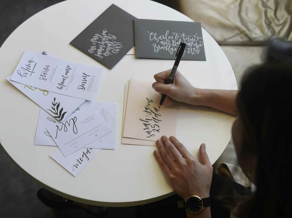 Stamford resident Anamarie Francisco, owner of Crafted calligraphy and styling, works on a calligraphy project at the J House Coffee Bar in the Riverside section of Greenwich, Conn. Wednesday, March 29, 2017. Francisco boosted her business through social media and recently started working with several Greenwich businesses.