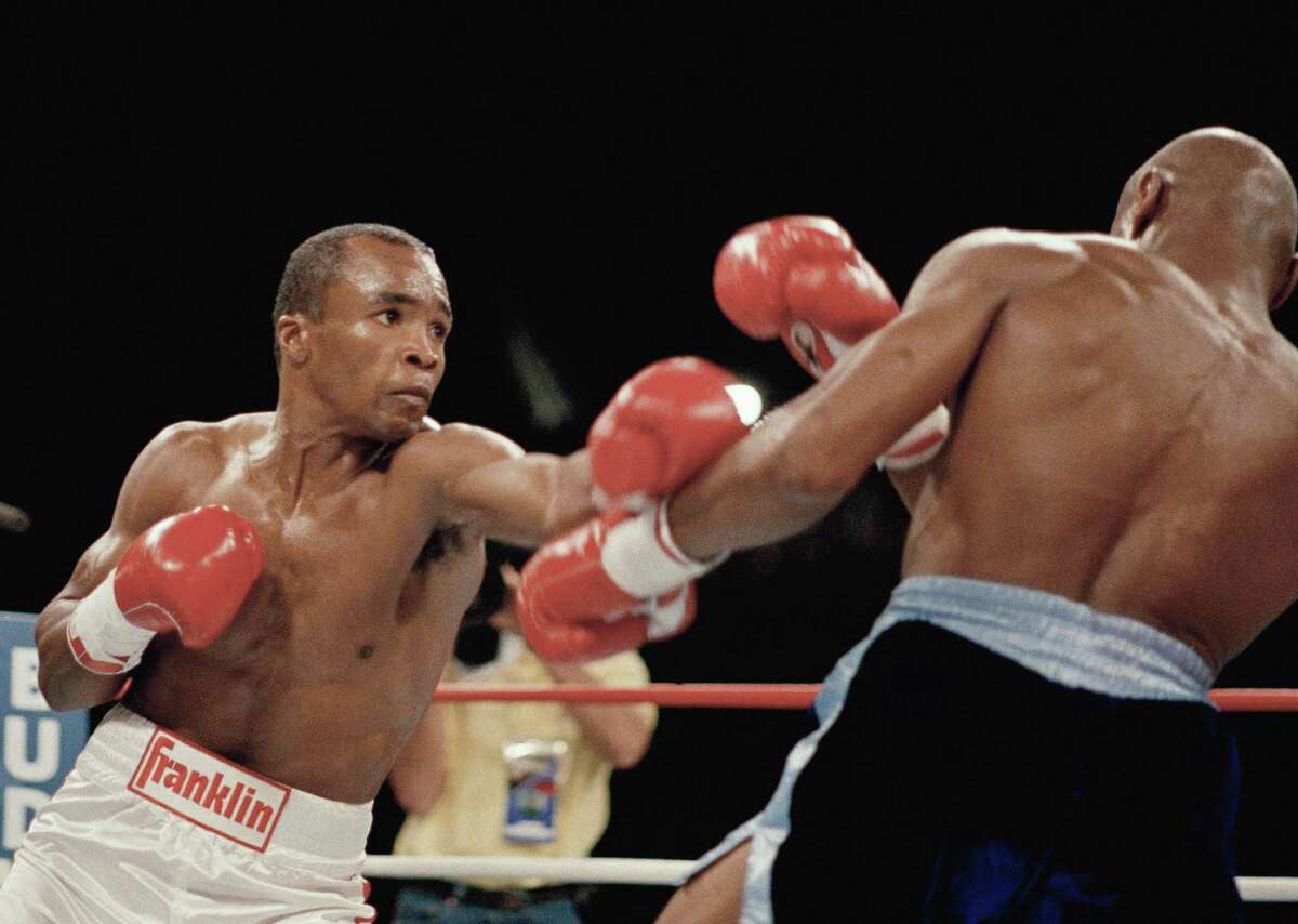 Sugar Ray Leonard (left) delivers a punch durin his bout with Marvin Hagler on April 6, 1987, in Las Vegas.
