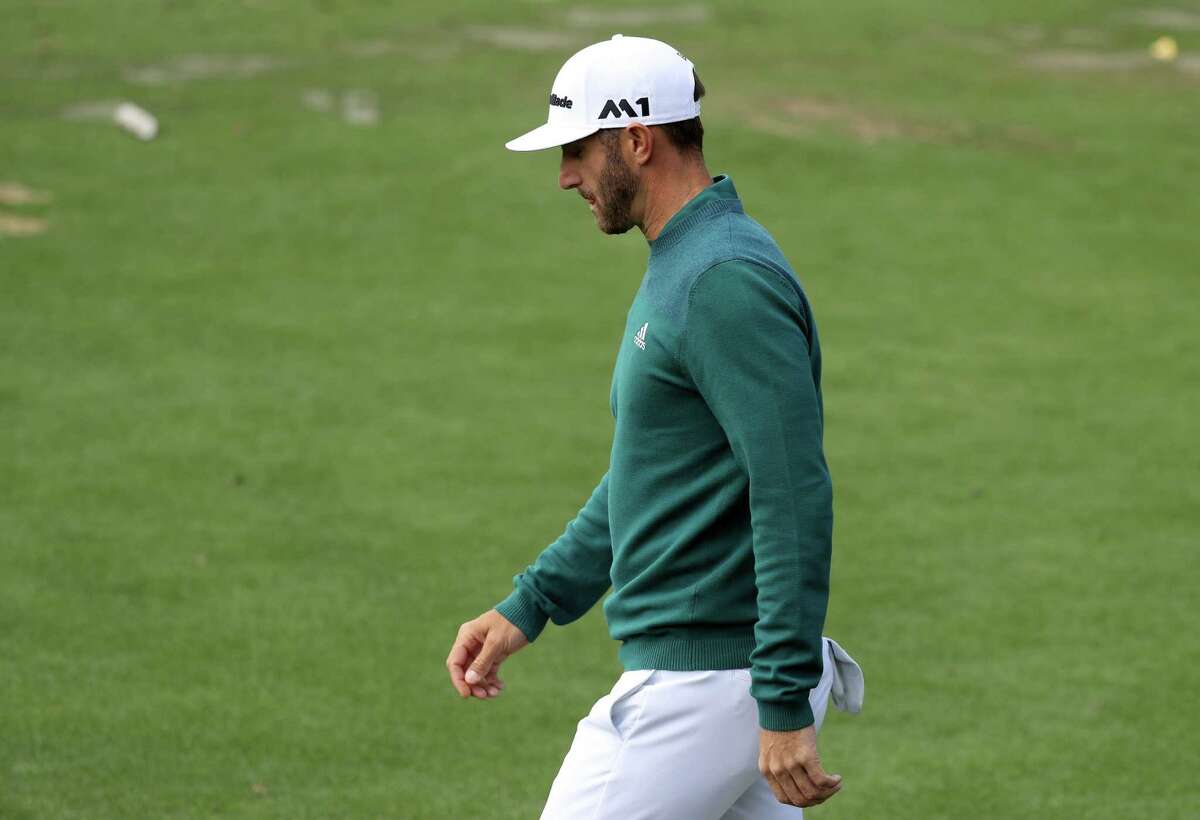 Dustin Johnson of the United States walks to the clubhouse after announcing his withdrawl during the first round of the 2017 Masters Tournament at Augusta National Golf Club on April 6, 2017 in Augusta, Georgia.