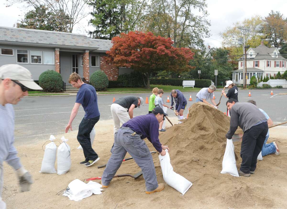 Greenwich residents fill sandbags at the Sound Beach Firehouse in Old Greenwich, Saturday afternoon, Oct. 27, 2012. The Town of Greenwich provided the sandbags to residents with the hope that they wll help to prevent flooding from the approaching Hurricane Sandy.