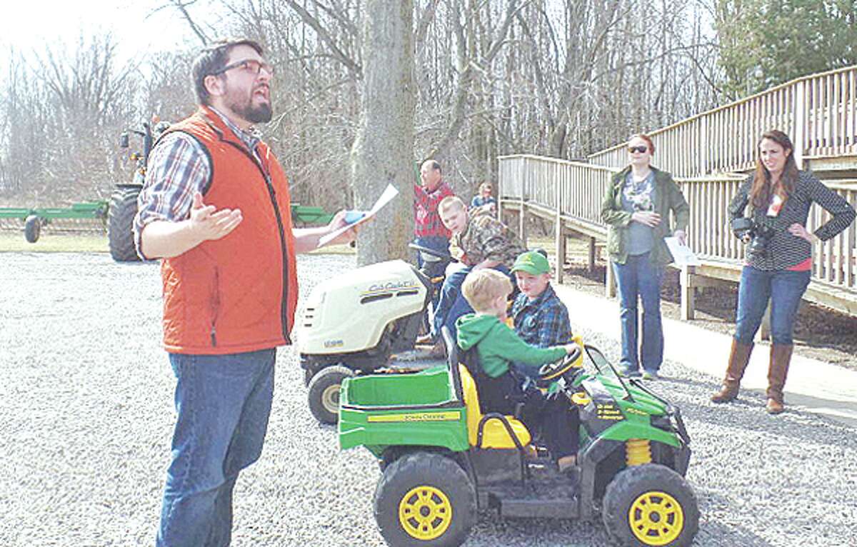   At right, Dustin Leipprandt, 10, drove a Cub Cadet lawn tractor while Massey Sherman, 4, and Noah Gokey, 5, each drove toy John Deere tractors. 