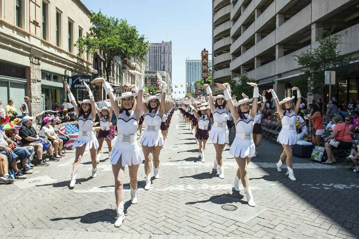 Members of the Texas State University Strutters march during the Battle of Flowers parade April 22, 2016.
