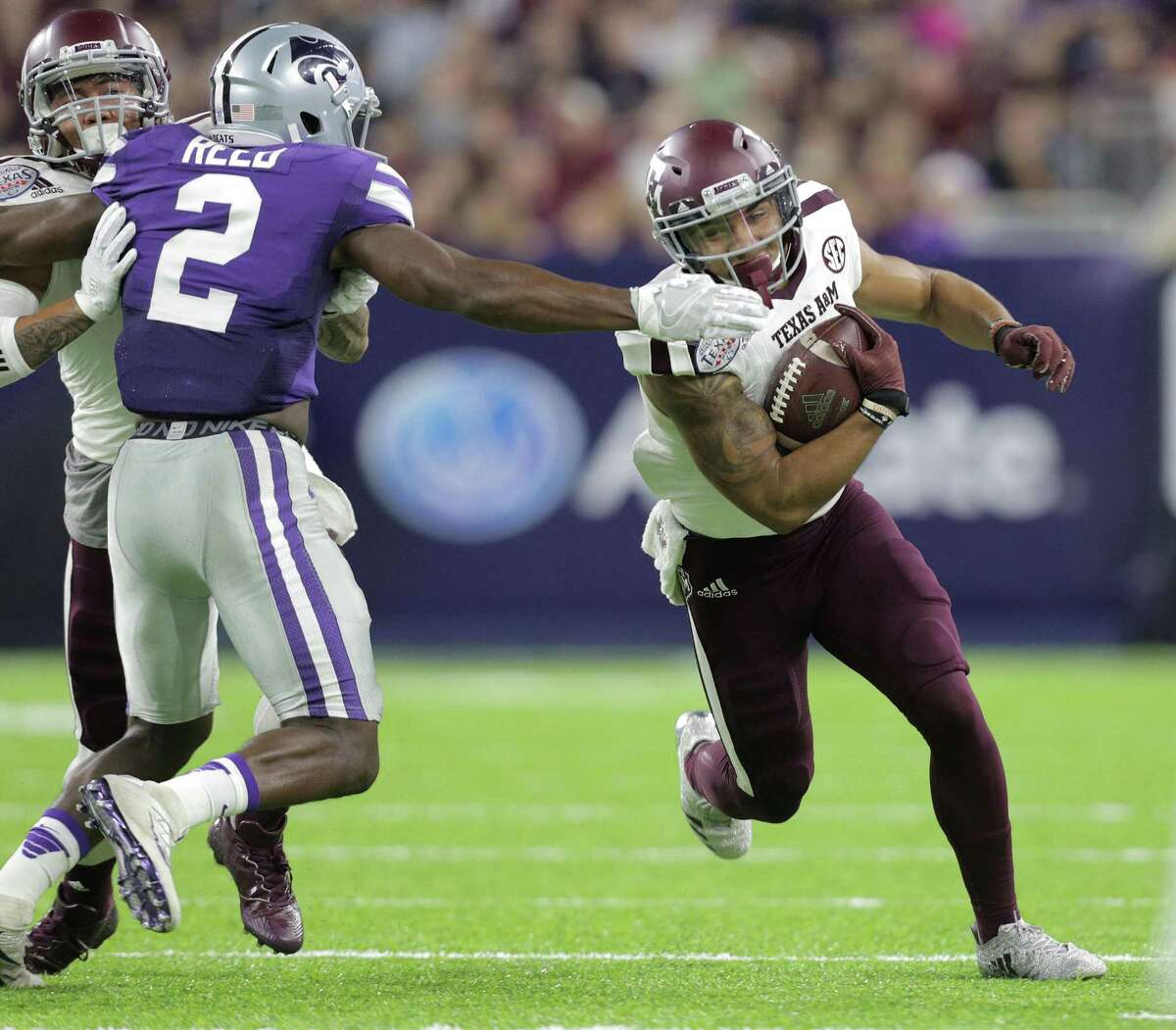Texas A&M wide receiver Christian Kirk (right) gets a first down on a fourth-and-1 during the first half of the Texas Bowl against Kansas State at NRG Stadium on Dec. 28, 2016, in Houston.