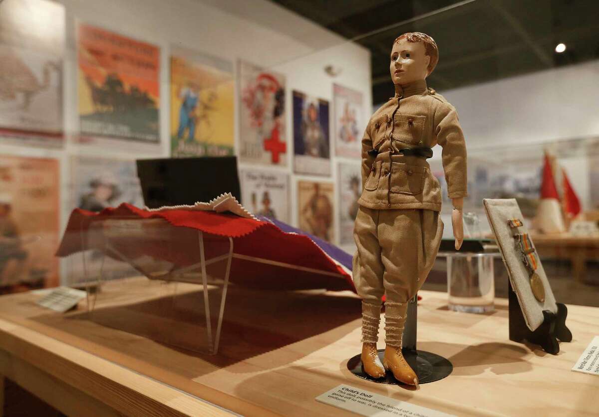 An artifact of a toy doll dressed in military fatigues is displayed as the Institute of Texan Cultures opens its "Texas in the First World War" on Thursday, marking the World War I centennial.﻿