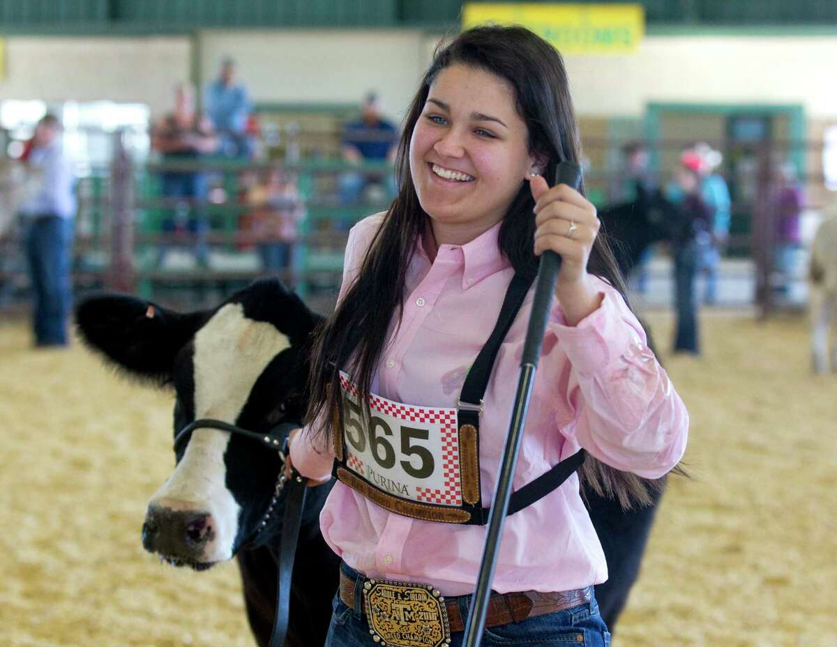 Taycee Aragon of Caney Creek FFA won grand champion during the replacement heifers show at the Montgomery County Fair Ground on Thursday, April 6, 2017, in Conroe.