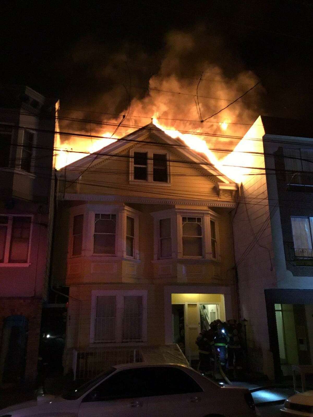 A heavy fire ripped through an apartment building in San Francisco’s Richmond District, injuring three people, officials said.