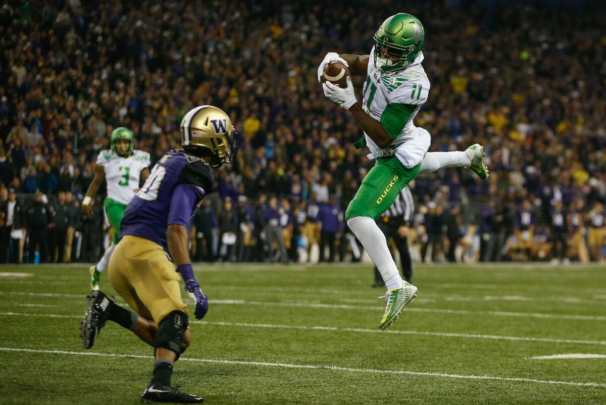 SEATTLE, WA - OCTOBER 17: Wide receiver Kirk Merritt #11 of the Oregon Ducks makes a catch against defensive back Kevin King #20 of the Washington Huskies on October 17, 2015 at Husky Stadium in Seattle, Washington. The Ducks defeated the Huskies 26-20 . (Photo by Otto Greule Jr/Getty Images)