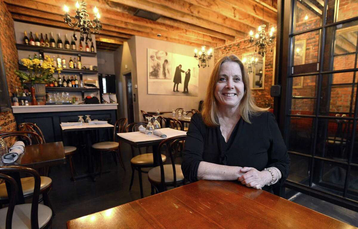 Carrin Schechter, owner of Noir is photograph inside the dining room of her Stamford restaurant on April 6, 2017.
