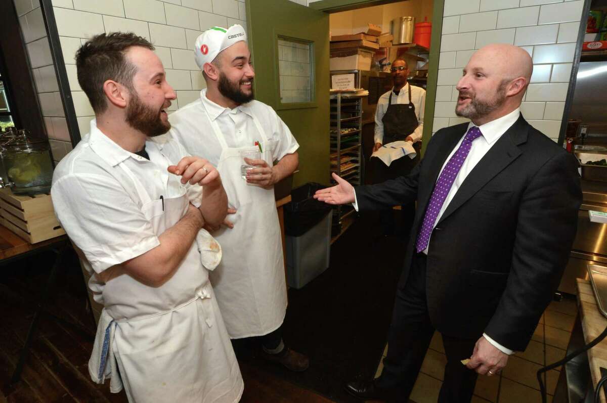 Executive Director of Operations with Amis, Jeff Benjamin talks with staff in the kitchen during a soft opening of the new Amis restaurant in Bedford Square on Thursday March 30, 3017 in Westport Conn. Amis is a Roman Trattoria created by Marc Vetri who owns three Amis restaurants in Philadelpha Pa.