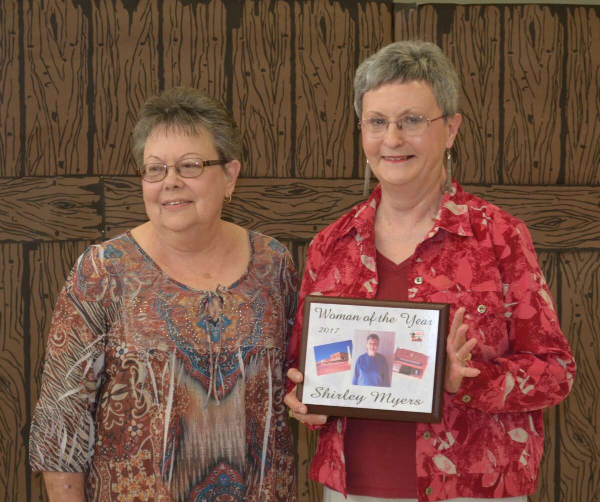 Tulia’s 2017 Woman of the Year Shirley Myers (right) receives her award plaque from the 2016 honorees, Jeannett Herring.