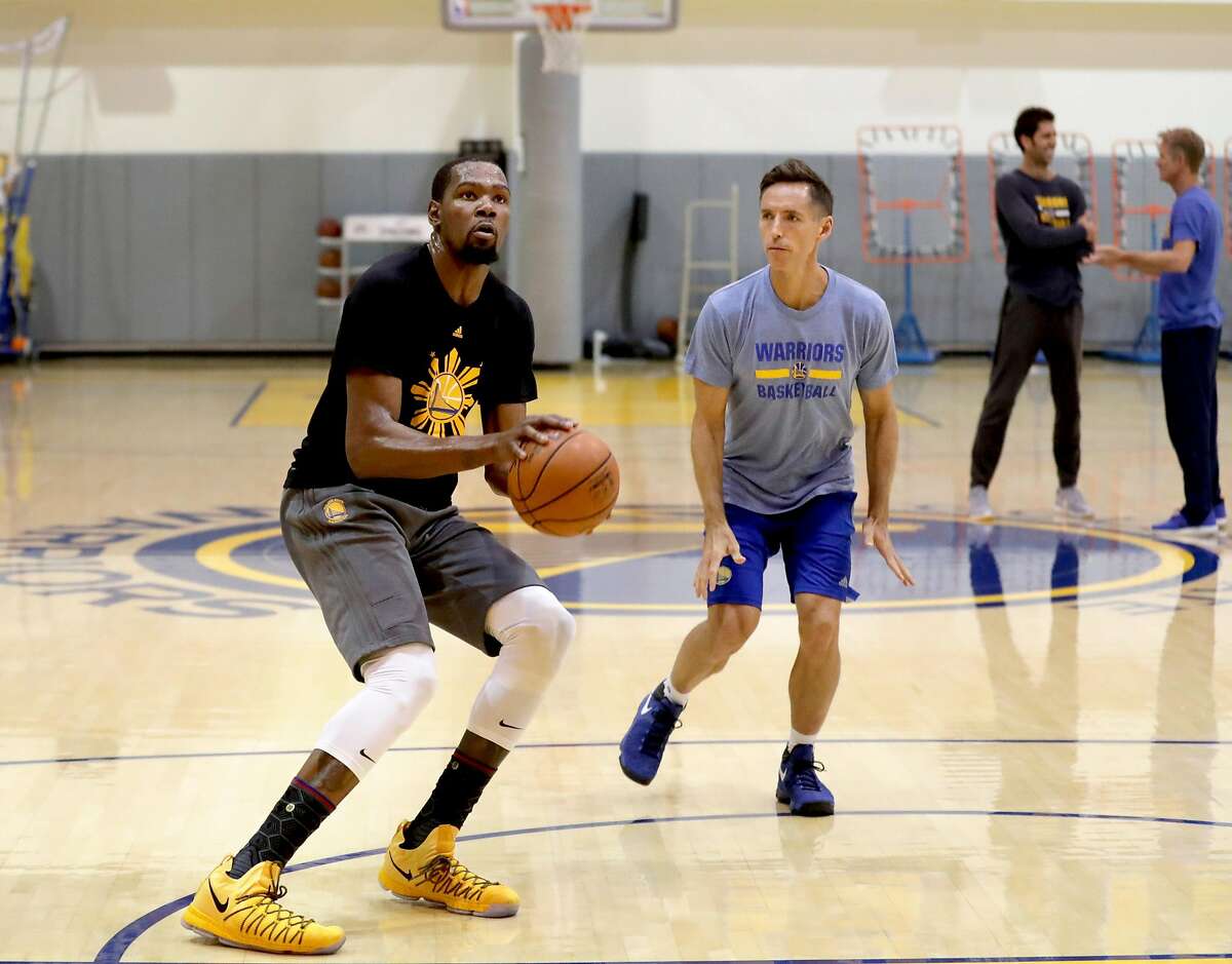Golden State Warriors' Kevin Durant was back at practice on Fri. April 7, 2017, working with Steve Nash at the Warriors' practice facility in Oakland, Calif. Durant will be rejoining the team after recovering from a knee injury.