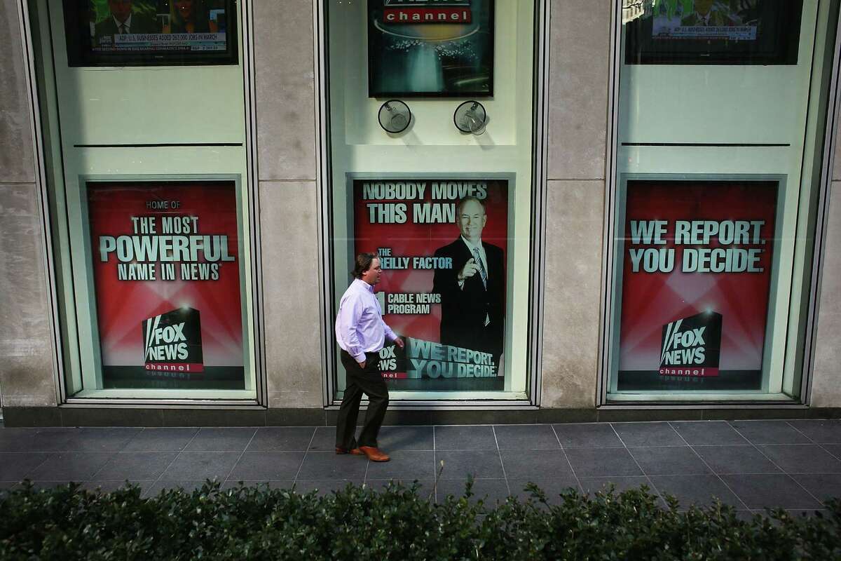 An advertisement for Bill O'Reilly, who hosts the top-rated Fox News show, is displayed in the window of the News Corporation headquarters on in New York. After allegations that he sexually harassed several women, major advertisers have pulled their ads from the program. A reader says the news deserved bigger play than it received in the Express-News.