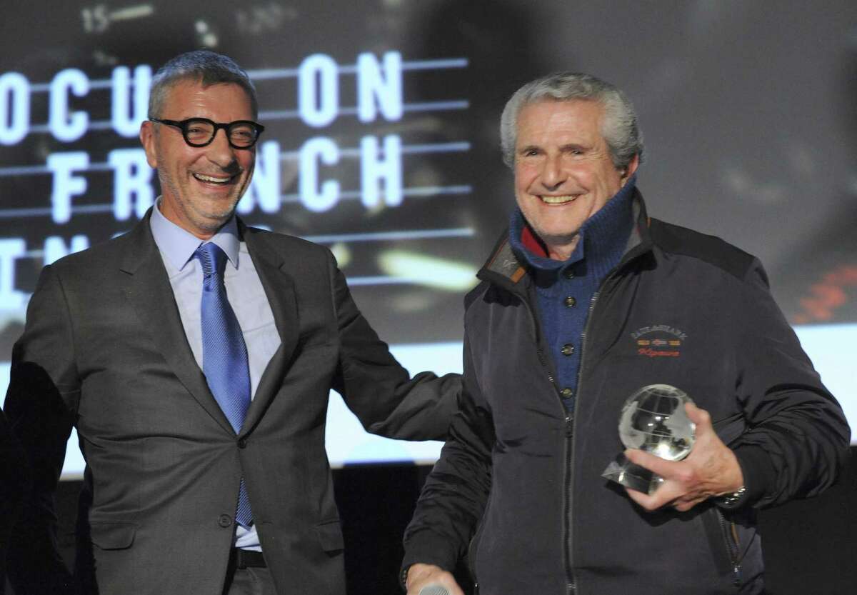 Jean Yves Fillion of BNP Paribas giving director Claude Lelouch the FOCUS award at Alliance Francais Greenwich Focus on French Cinema's 13th annual festival last weekend at the Bow Tie Cinemas in Greenwich.