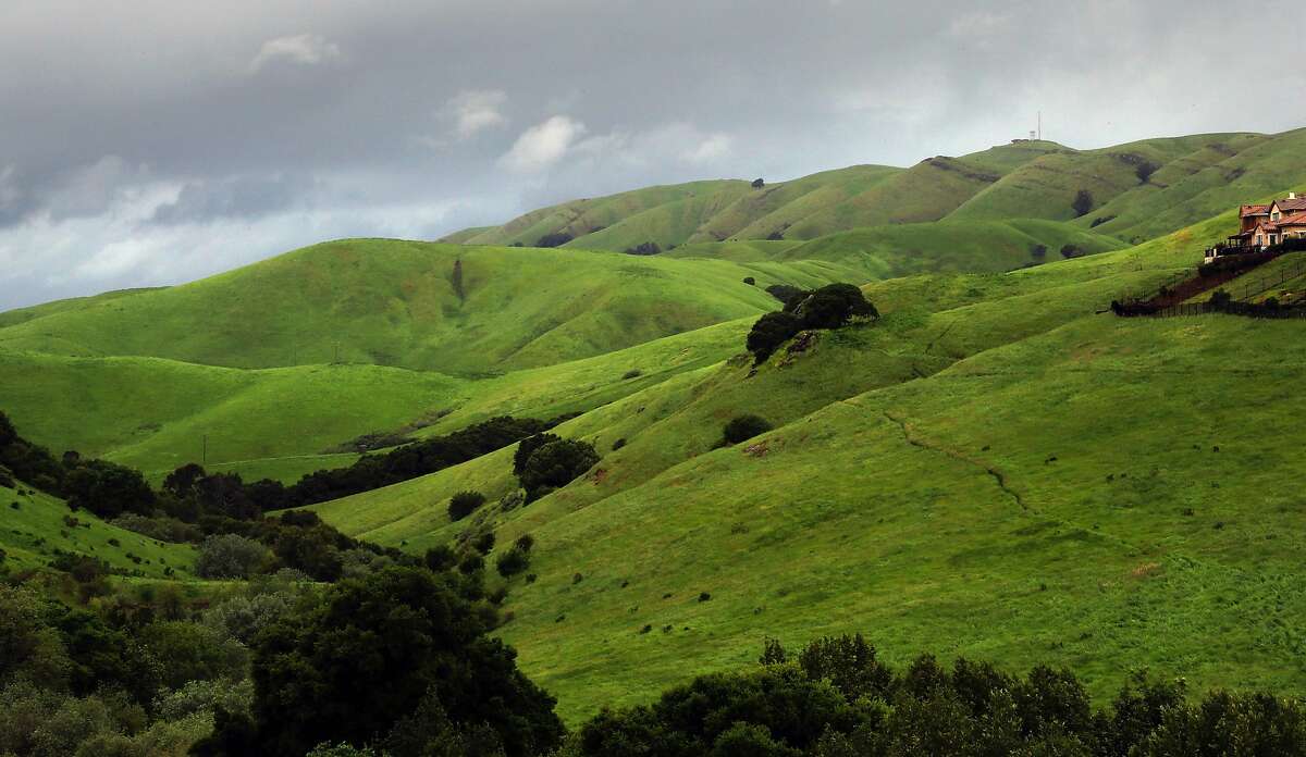 Winter rains turned the hills above Dublin, Calif. an emerald green as seen on Fri. April 7, 2017. State fire control officials are worried that the rainy season of 2020 has produced so little rain and that the risk of wildland fires is still high.