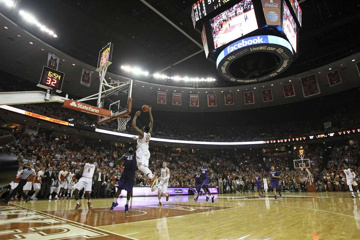 Cameron Ridley gets a big slam dunk under the Jumbotron as the Texas Longhorns host Kansas State at the Erwin Center in Austin on March 7, 2015.