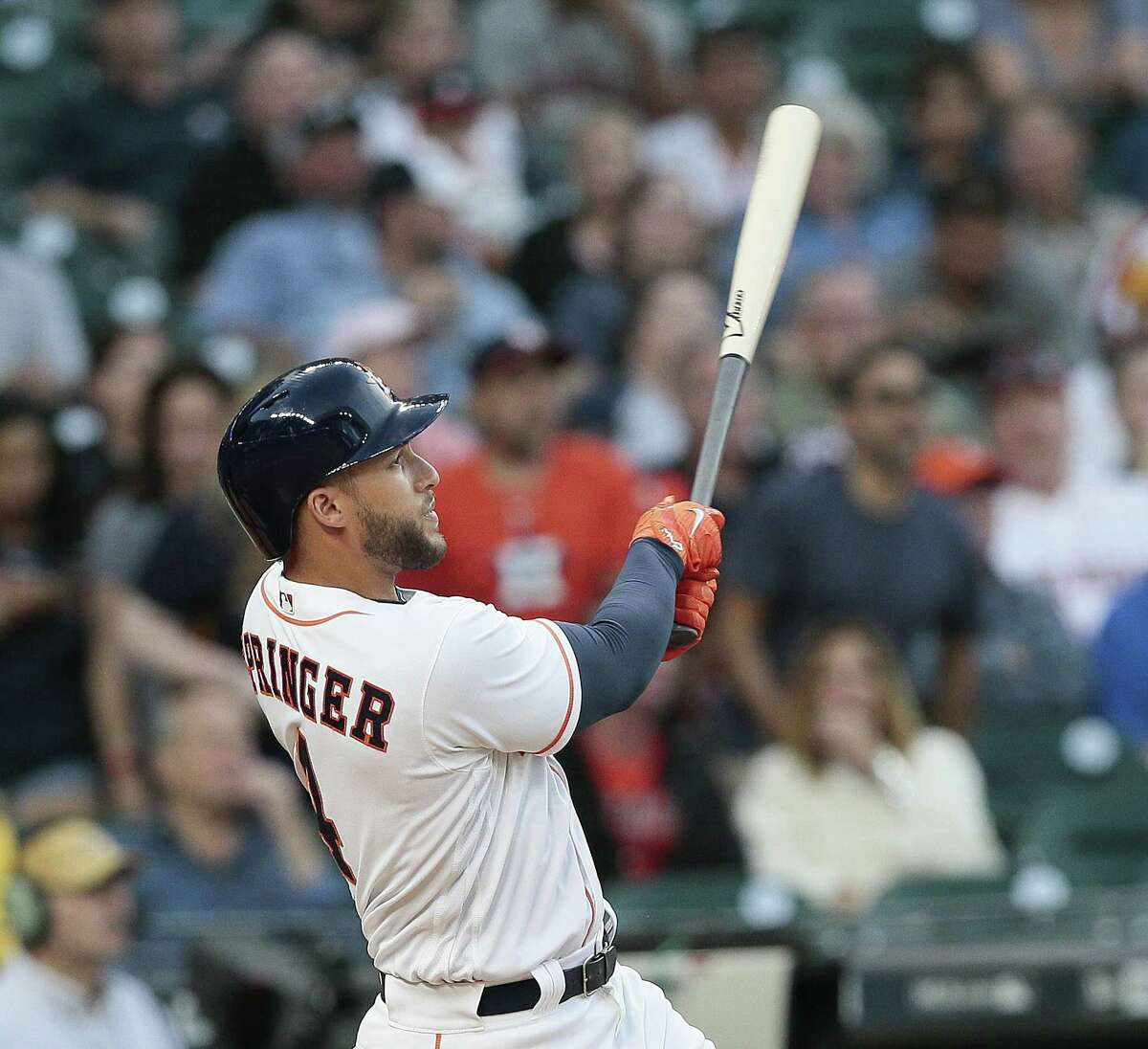 Astros outfielder George Springer hits a homer in the first inning against the Seattle Mariners at Minute Maid Park on Thursday. (Photo by Bob Levey/Getty Images)