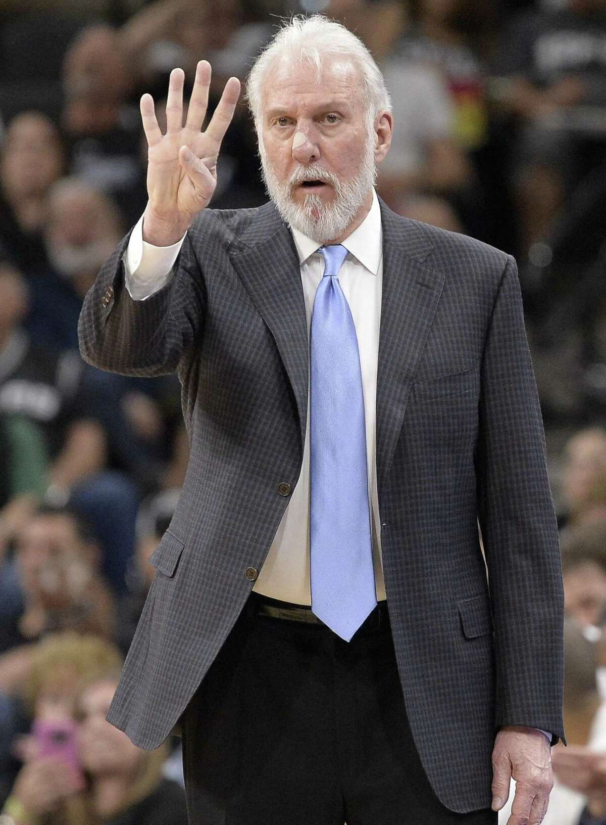 San Antonio Spurs head coach Gregg Popovich signals to his players during the second half of an NBA basketball game against the Memphis Grizzlies, Tuesday, April 4, 2017, in San Antonio. San Antonio won 95-89 in overtime. (AP Photo/Darren Abate)