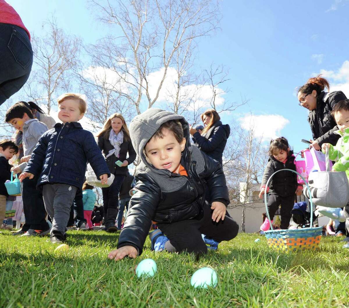 Anthony Gonzalez, 4, of Greenwich, reaches for an egg during the Presbyterian Church of Old Greenwich Easter Egg Hunt at the church in Old Greenwich, Conn., Saturday morning, April 8, 2017.