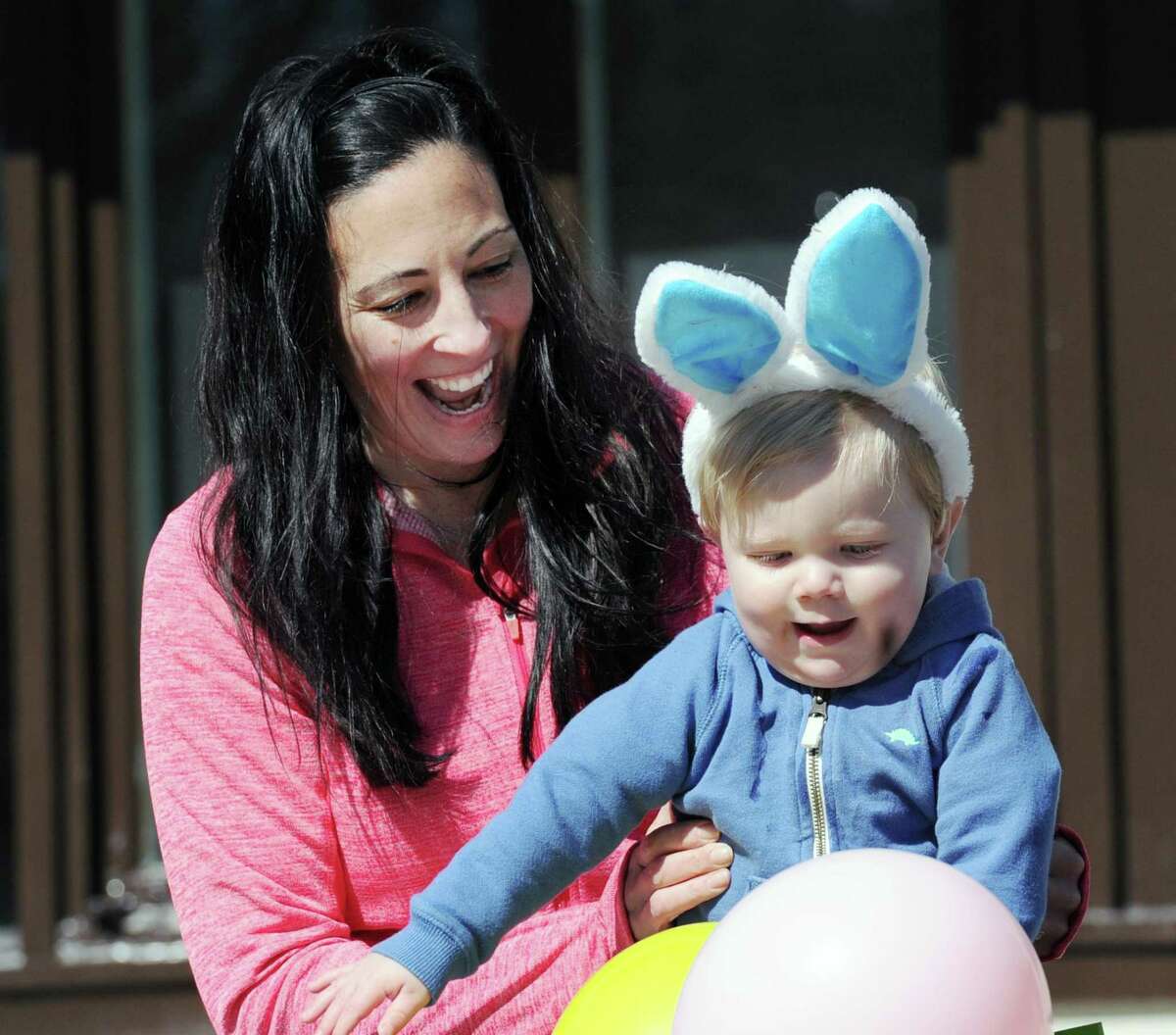 Cindy Horrmann of Old Greenwich smiles along with her son Jack, 15-months, as the pair played with balloons during the Presbyterian Church of Old Greenwich Easter Egg Hunt at the church in Old Greenwich, Conn., Saturday morning, April 8, 2017.