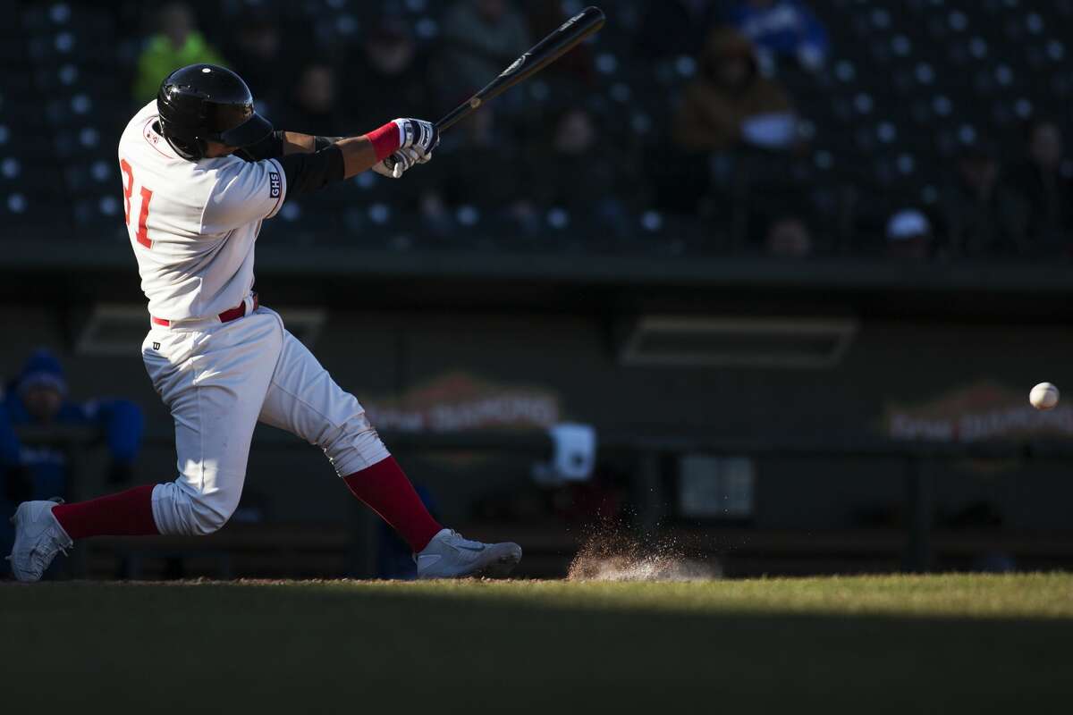 Great Lakes Loons batter Keibert Ruiz connects for a hit in a game against the Lansing Lugnuts at Dow Diamond on Friday.