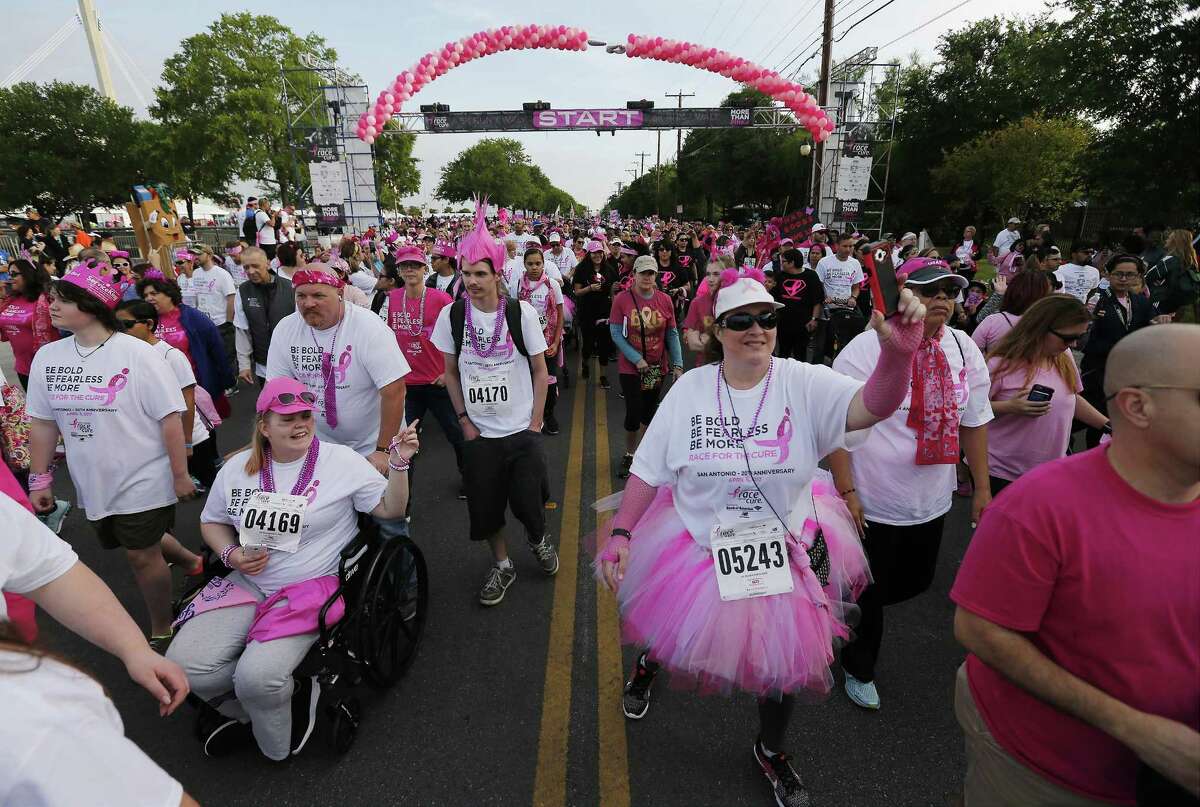 Thousands gather for the 20th anniversary of the Susan G. Komen Race for the Cure at the Alamodome on Saturday, Apr. 8, 2017. Participants raise money for breast cancer research and treatment. Many who took part in the five kilometer run and walk are either breast cancer survivors or are taking part in honor of someone who has the disease. The race started at 8 a.m. and wound around downtown and finished back at the Alamodome. (Kin Man Hui/San Antonio Express-News)
