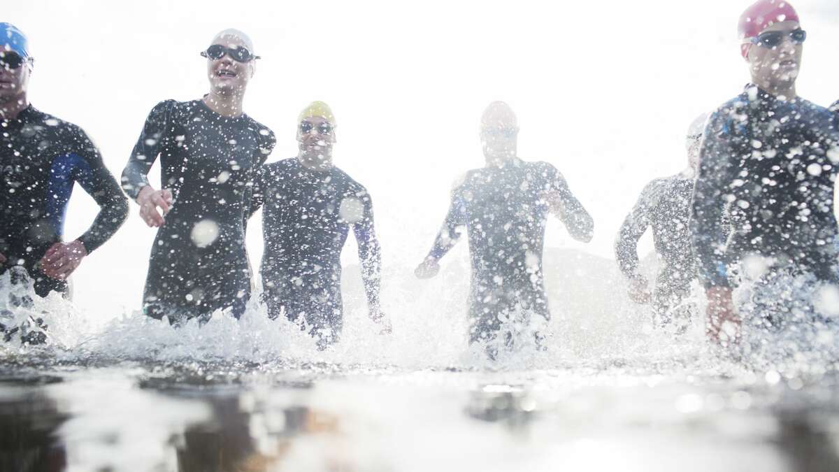 File photo of traithletes. One person was hospitalized and 30 others suffered from symptoms of hypothermia during the HITS Napa Valley triathlon in Napa County on Saturday morning.  