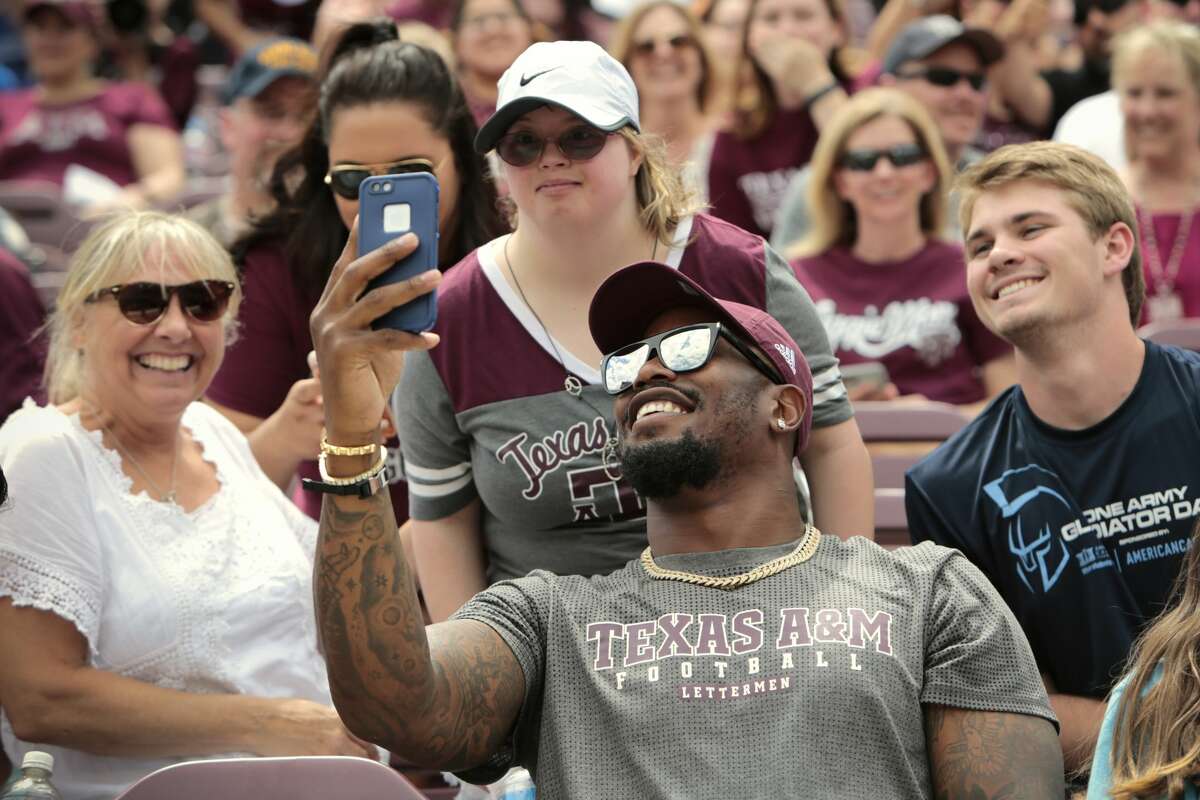Denver Broncos linebacker and Texas A&M alumn Von Miller poses for photos with Aggies fans during the Texas A&M spring football game at Kyle Field on Saturday, April 8, 2017, in College Station. ( Brett Coomer / Houston Chronicle )