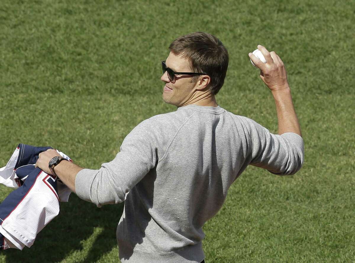 New England Patriots quarterback Tom Brady throws a ceremonial first pitch before a baseball game between the Boston Red Sox and the Pittsburgh Pirates on opening day at Fenway Park, Monday, April 3, 2017, in Boston. (AP Photo/Steven Senne)