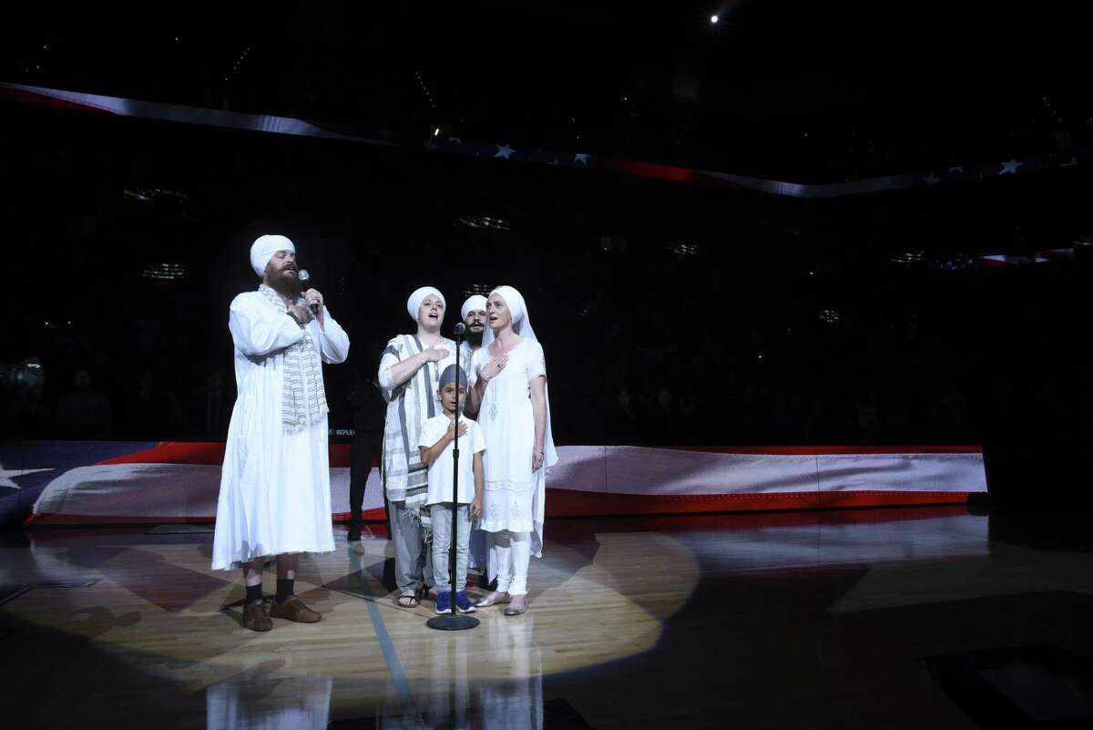 Members of San Antonio Sikh community sing the Star Spangled Banner before the Spurs host the Los Angeles Clippers in NBA action at the AT&T Center on April 8, 2017. An allegedly inebriated Spurs fan made racially offensive remarks to Sikh fans after a recent Spurs game.