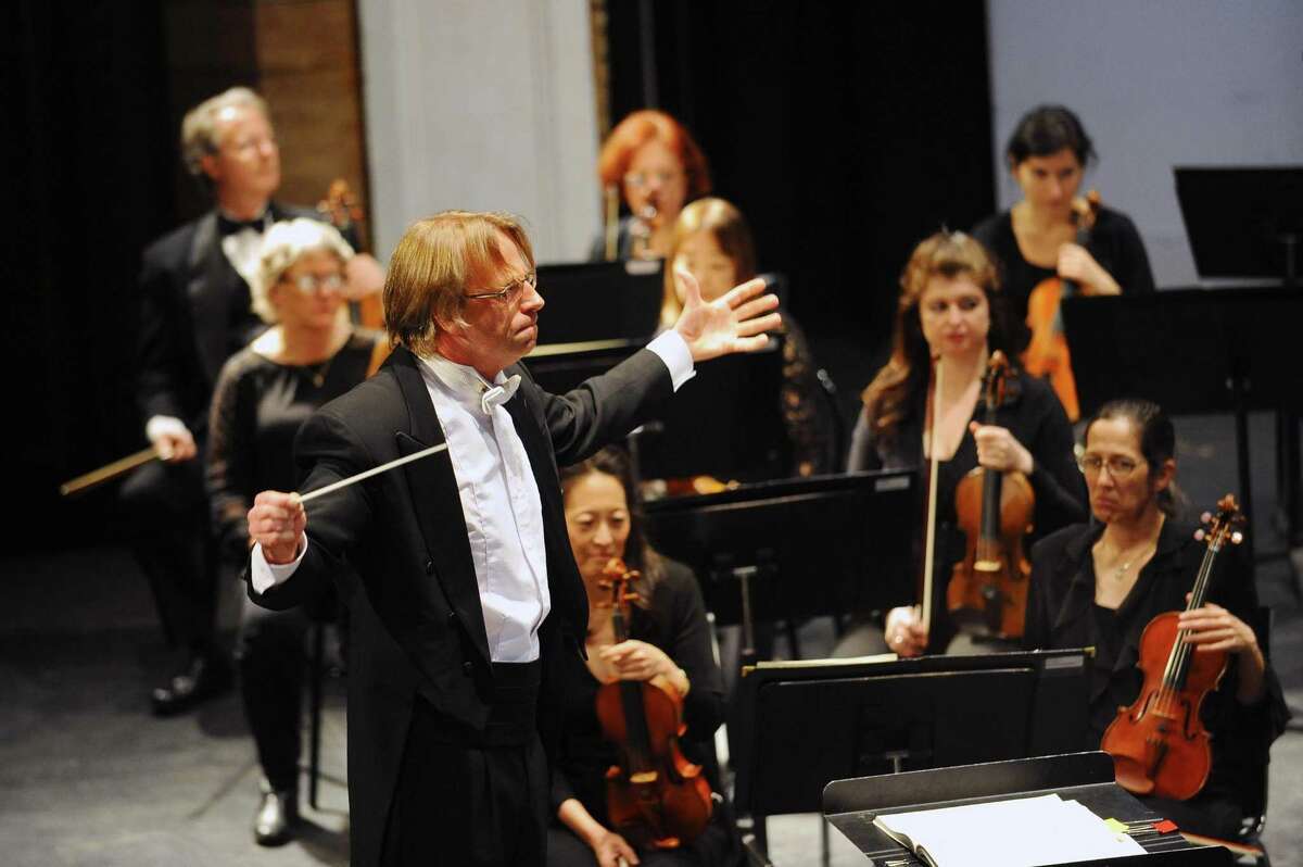 Stamford Symphony musical director and conductor Eckart Preu conducts a piece during his final concert with the Stamford orchestra on Sunday at the Palace Theatre on Sunday.