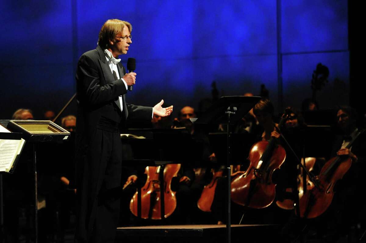 Stamford Symphony musical director and conductor Eckart Preu speaks to the audience before his final concert "Northern Lights" inside the Palace Theater in Stamford, Conn. on Sunday, April 9, 2017.