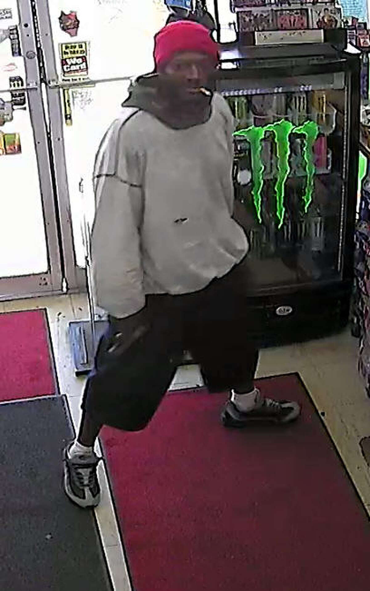 Police described the two robbers who stormed into a Baytown store and shot the clerk on April 9 as two black males, the first approximately 5’10, approximately 200 pounds, wearing a gray hoodie, baggy shorts and a red hat. The second suspect, also about 5’10”, weighing approximately 250 pounds, was wearing a white hoodie, dark shorts and a black mask covering his face, police said.