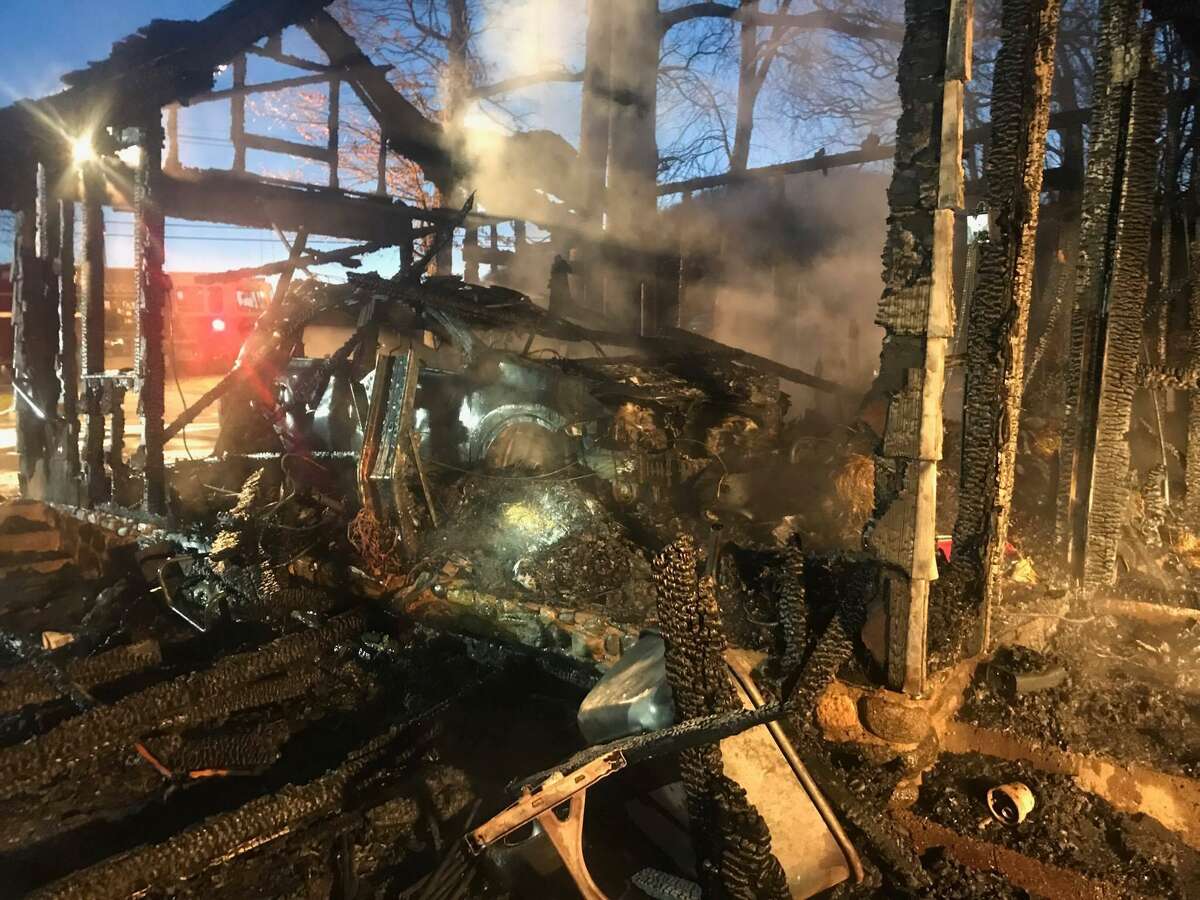 Photos Garage fire engulfs 2 vehicles, damages house