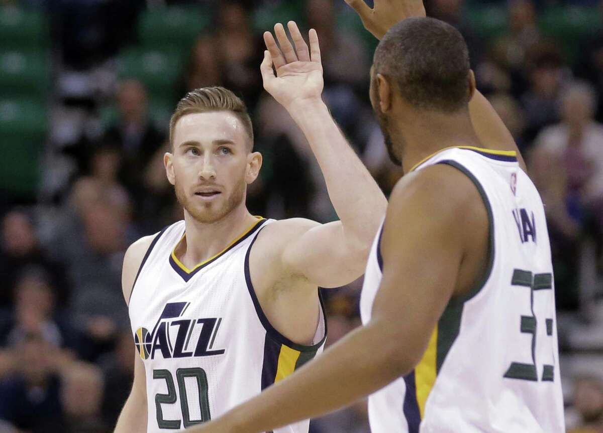 Utah Jazz’s Gordon Hayward receives a high-five from teammate Boris Diaw (33) after scoring against the Portland Trail Blazers during the second half on April 4, 2017, in Salt Lake City. The Jazz won 106-87.