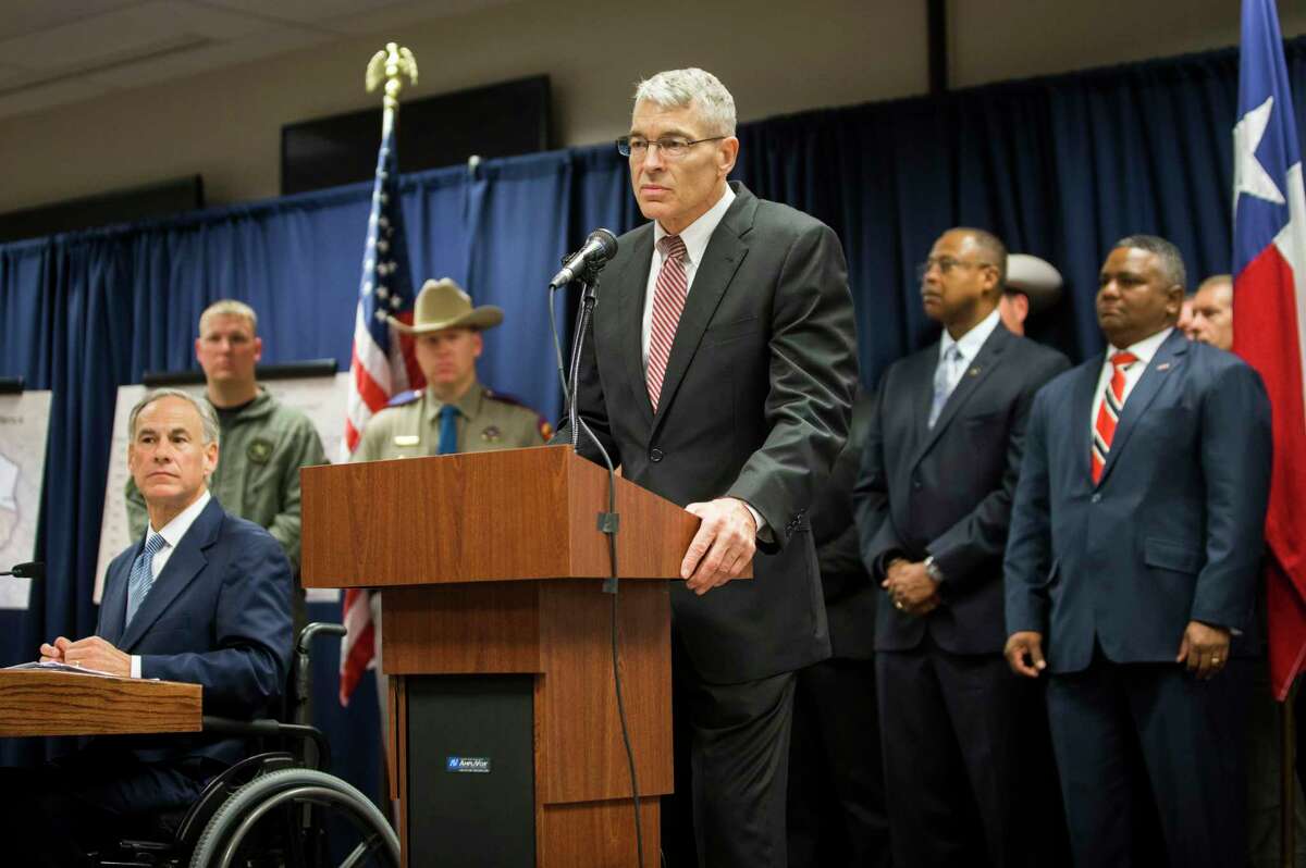 Steve McCraw, right, director of the Texas Department of Public Safety joined Texas Governor Greg Abbott, left, to announce a new plan against gang violence, Monday, April 10, 2017, in Houston.