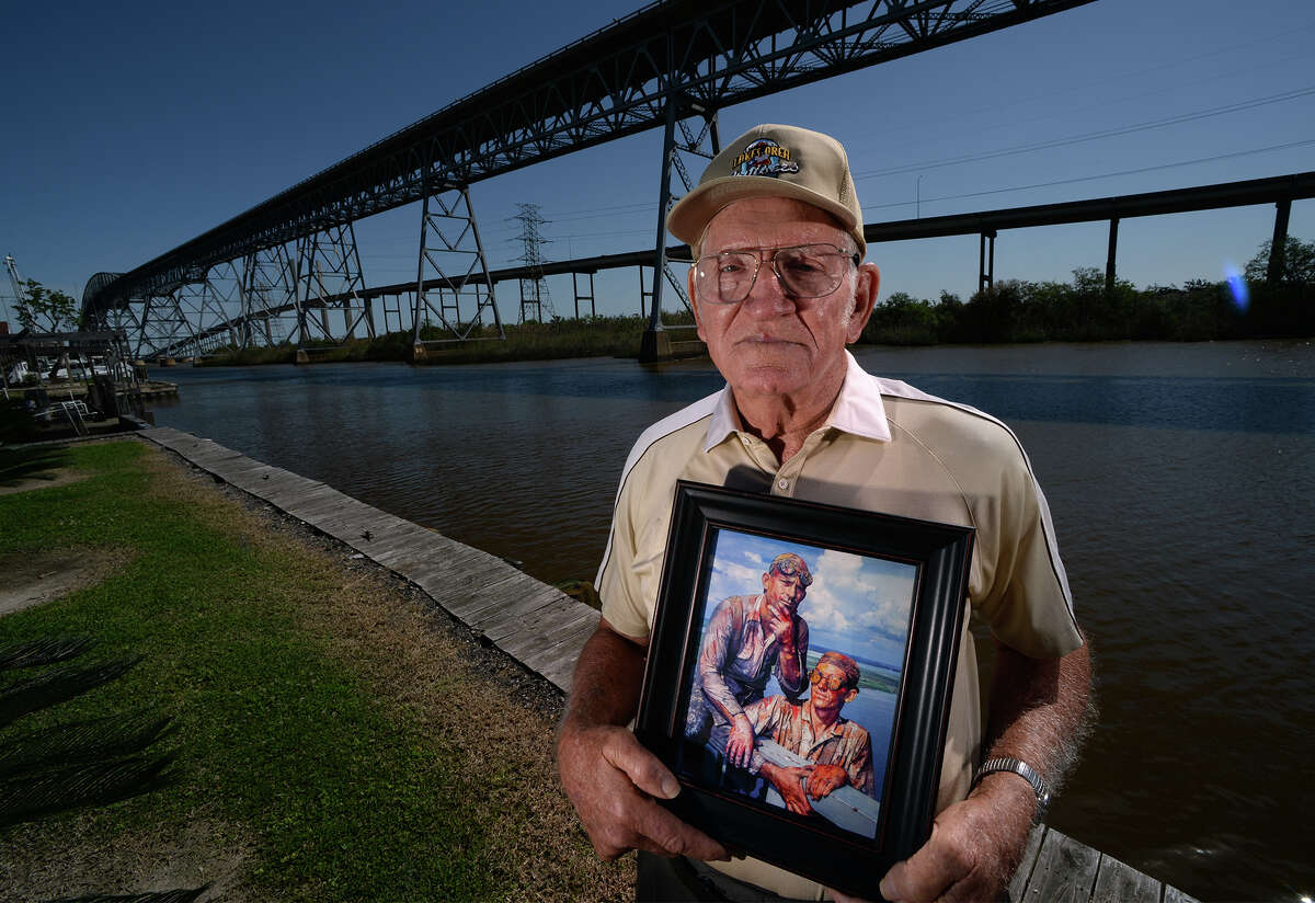 Harold Ringer holds a picture featuring himself, right, and a coworker on the Rainbow Bridge that was used on the cover of a Texas Highway Magazine issue 60 years ago. Ringer talked about the pride and dangers of working on the bridge and the day the photo was taken. Photo taken Wednesday, April 05, 2017 Guiseppe Barranco/The Enterprise