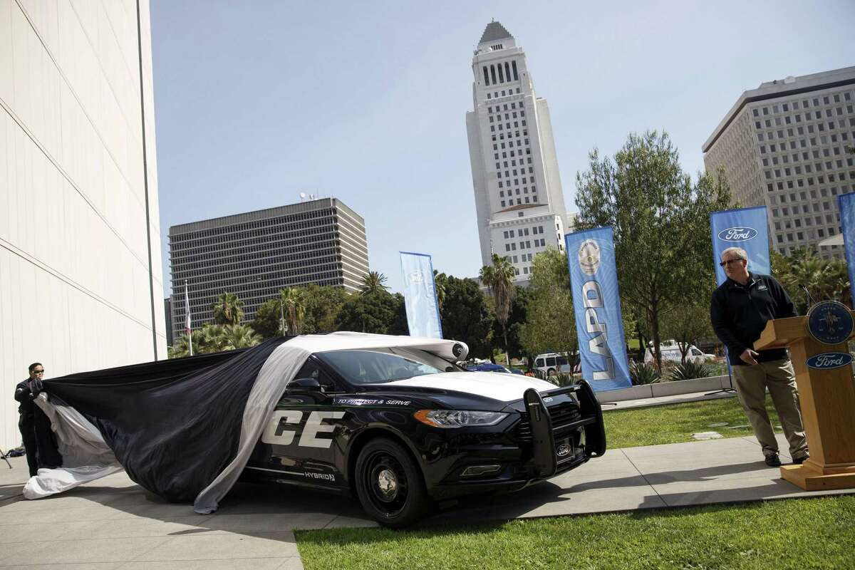 Kevin Koswick, director of North American fleet lease and remarketing at Ford Motor Co., speaks as the company’s new Police Responder hybrid vehicles are unveiled during a Monday event in Los Angeles.