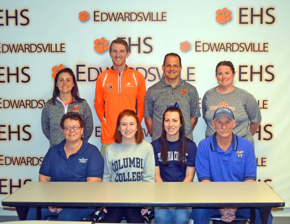 Edwardsville senior Victoria Vegher will compete in cross country and track and field at Columbia College. In the front row, from left to right, are mother Kim Vegher, Victoria Vegher, sister Brittany Dudley and father Dan Vegher. In the back row, from left to right, are EHS assistant cross country coach Maggie Dust, EHS assistant cross country coach and assistant girls’ track and field coach Dustin Davis, EHS cross country coach George Patrylak and EHS girls’ track and field coach Camilla Eberlin.