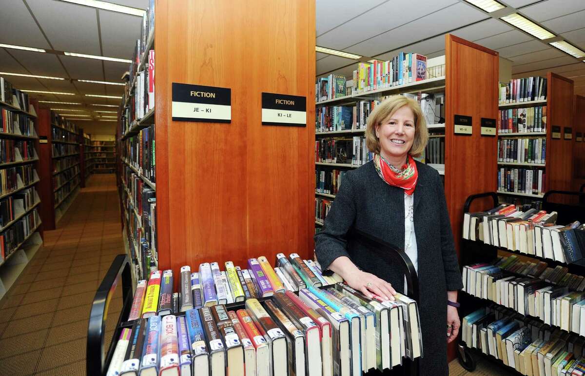 Ferguson Library President Alice Knapp poses for a photo inside the main branch of the library in downtown Stamford.