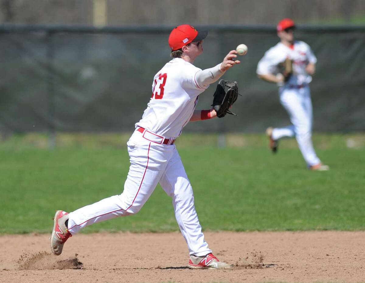 Greenwich second baseman Ricky Columbo throws out a Darien baserunner on Monday at GHS.