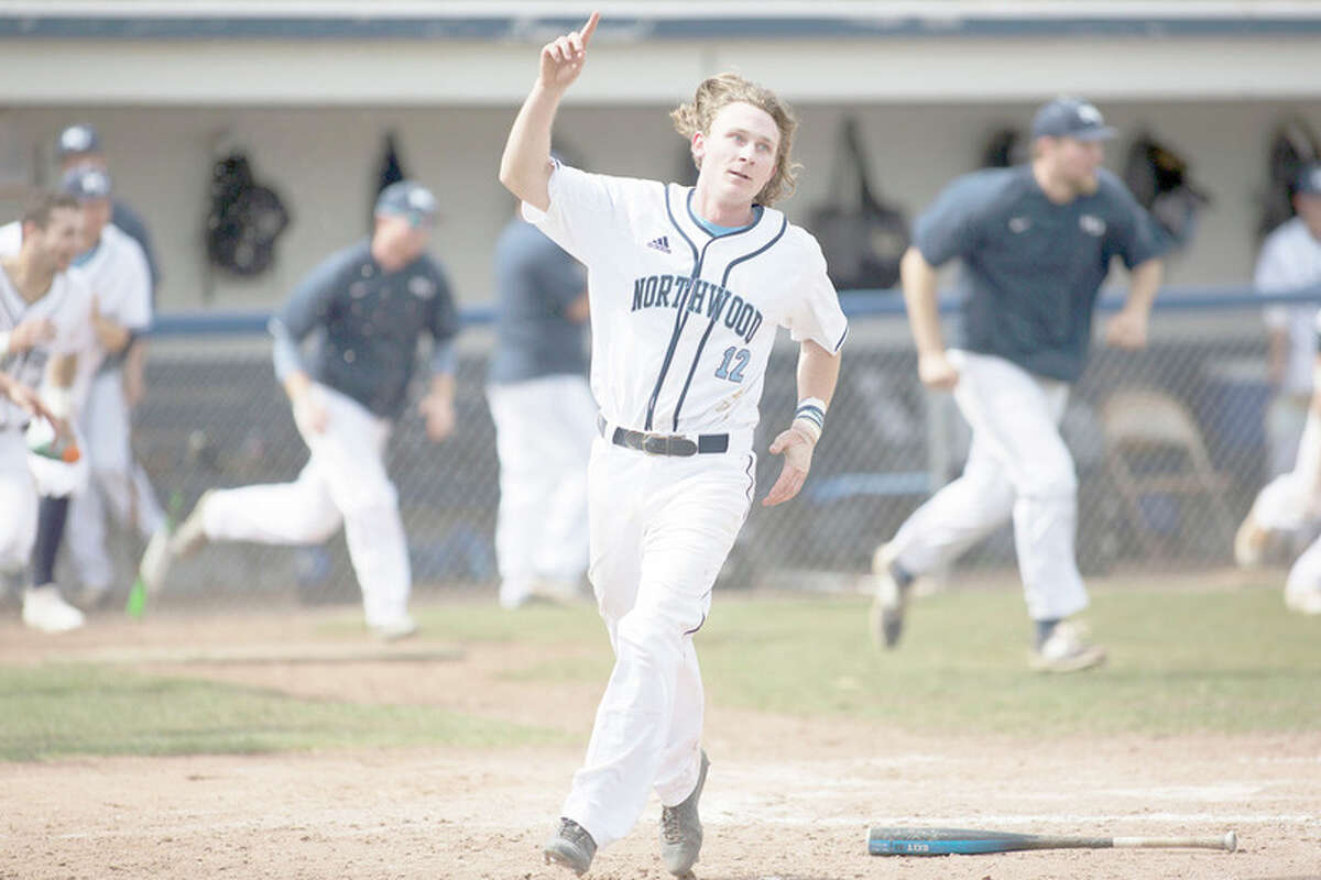 THEOPHIL SYSLO | For the Daily News Northwood's Connor Foley celebrates after scoring the winning run in a game against Lake Erie on Sunday. Four years after earning the win in the state championship game as a senior at Bay City Western, Foley is making his senior season at Northwood a very memorable one as well.