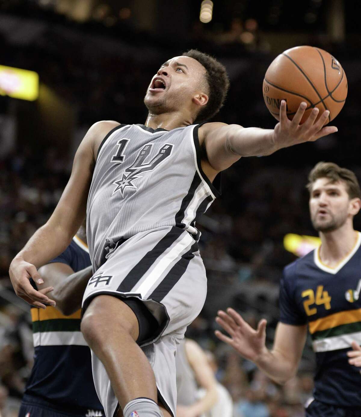 San Antonio Spurs forward Kyle Anderson (1) shoots during the first half of the team's NBA basketball game against the Utah Jazz, Sunday, April. 2, 2017, in San Antonio. (AP Photo/Darren Abate)