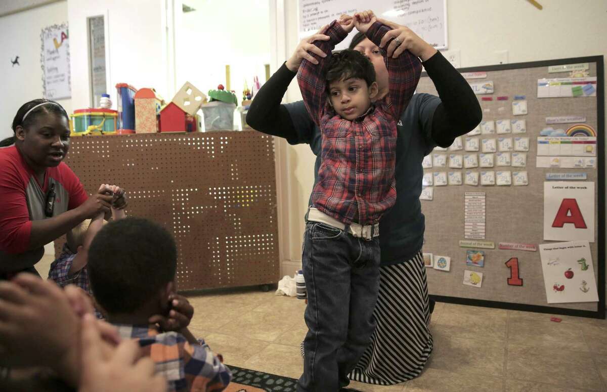 Deseree Fojtik, a registered behavior technician, works with Micah Rajan, 4, at Texana Center on Friday, April 7, 2017, in Rosenberg. The Texas Legislature is looking at a bill that would mandate licensure for applied behavior specialists, who often work with autistic people. ( Elizabeth Conley / Houston Chronicle )