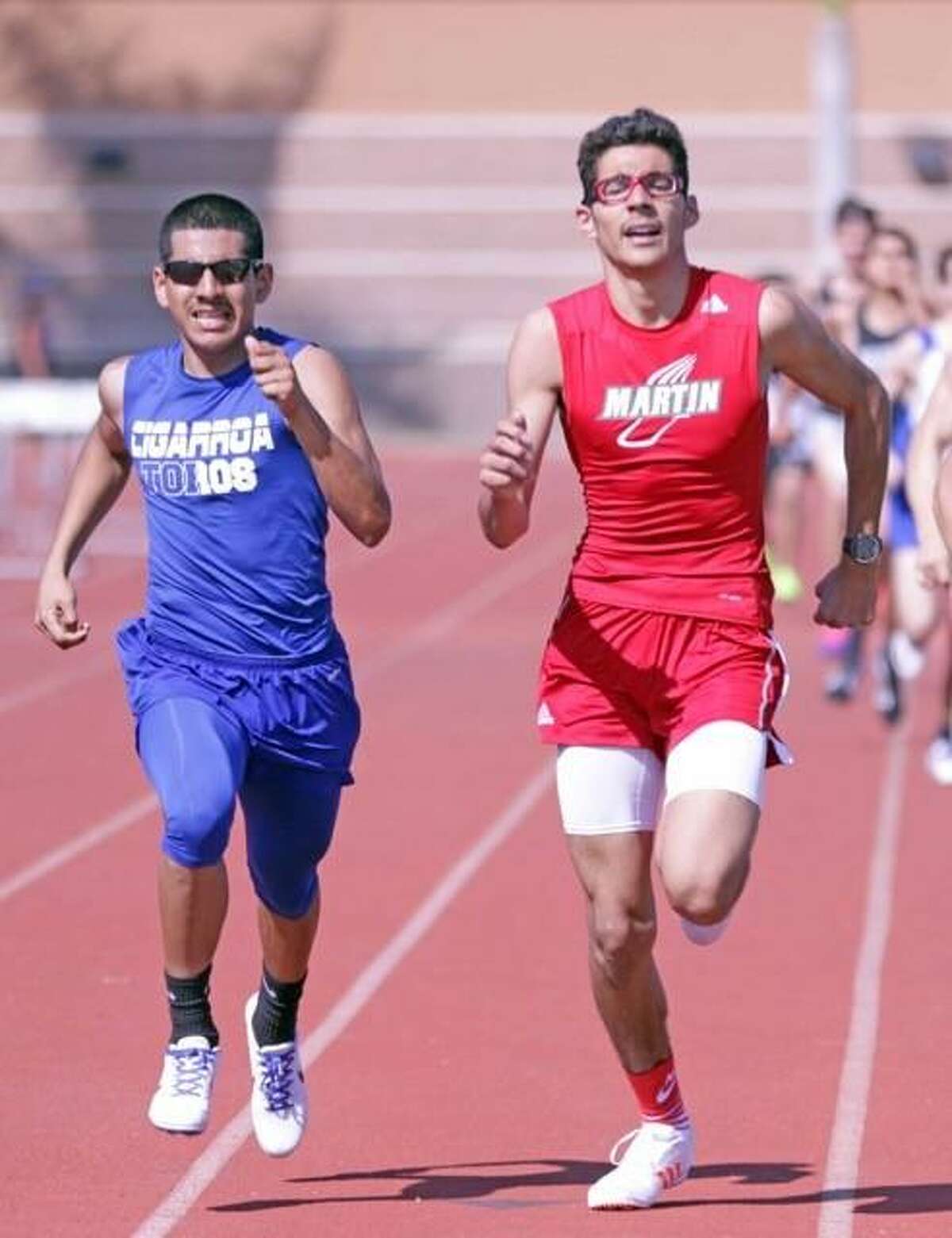 Cigarroa's Leeroy Raya and Martin's Miguel Escamilla compete in the 800-meter run.