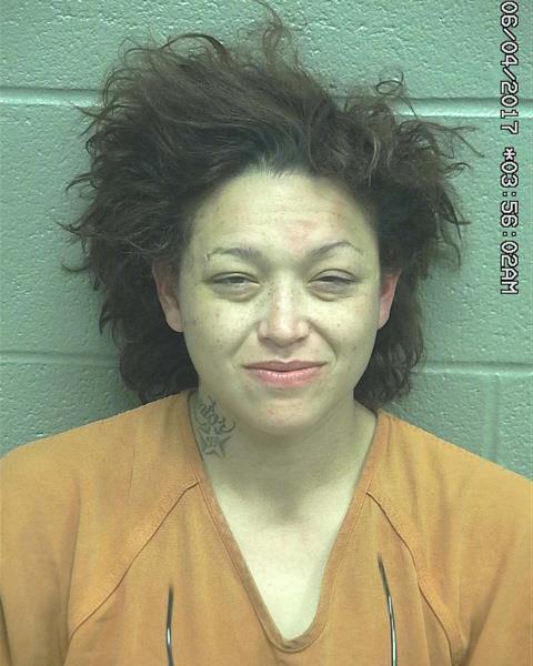 Woman arrested on burglary charge