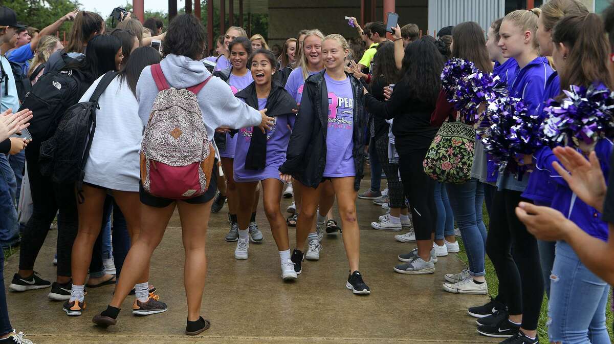 Members of the Boerne High School girls soccer team (center, wearing purple T-shirts) are greeted Tuesday April 11, 2017 by other students at a send-off event at Boerne High School. The team plays Wednesday at the UIL Class 4A state tournament in Georgetown.